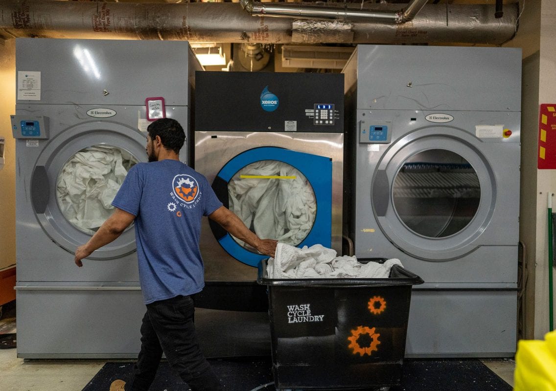 Postindustrial, Louie Colon works at Wash Cycle Laundry in Philadelphia. Photo by Jessica Kourkounis